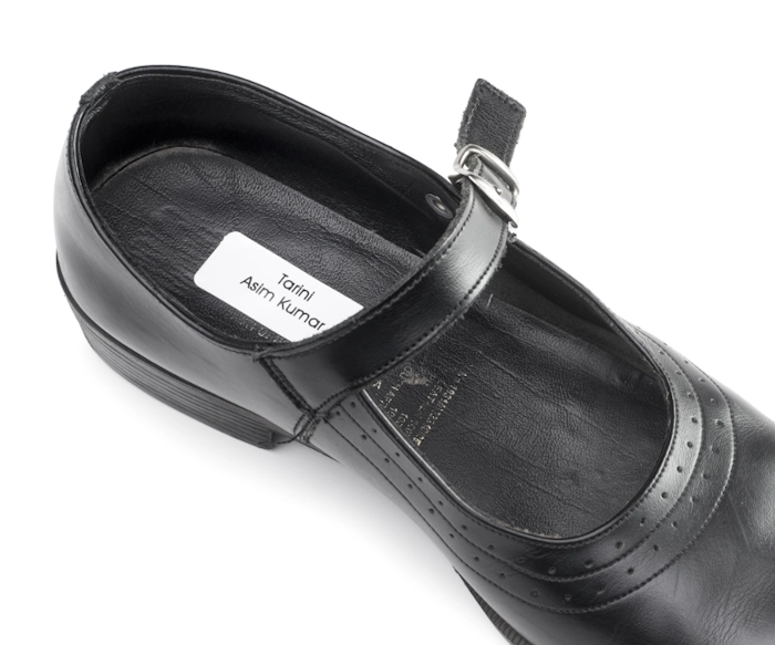 Personalised shoe labels with clear protective covers applied inside children’s shoes