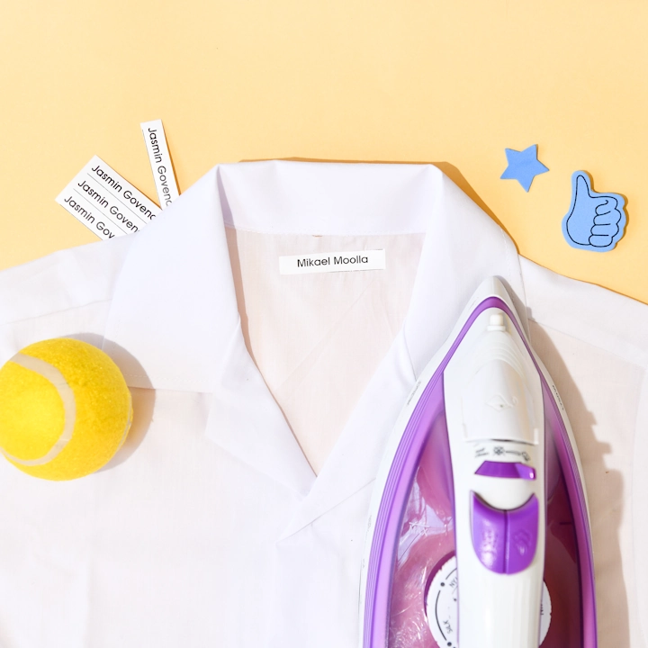 Personalised iron-on clothing label applied to children’s clothing and school uniform.