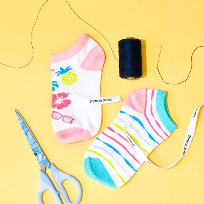 Sew-on name labels sewn onto garments for easy identification.